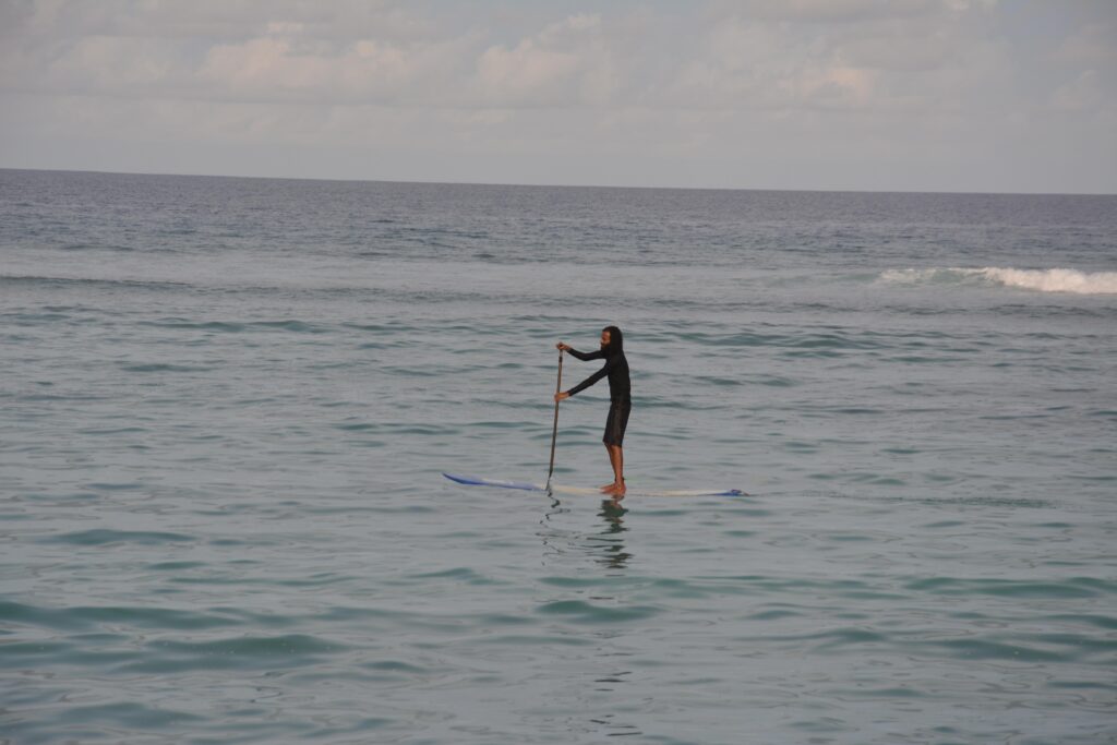 stand up paddleboarding in local island in maldives