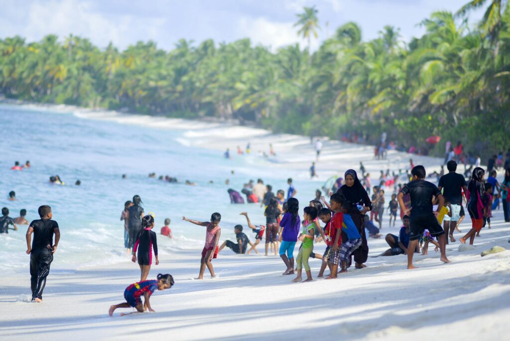 maldivian local community family beach island life